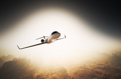 照片白色光泽豪华通用设计私人喷气式飞机在天空下在地球表面飞行。大峡谷背景日出。商务旅行图片.水平，直角视图.电影效果。3d 渲染.