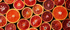 背景新鲜红橙柑橘果纹的特写 