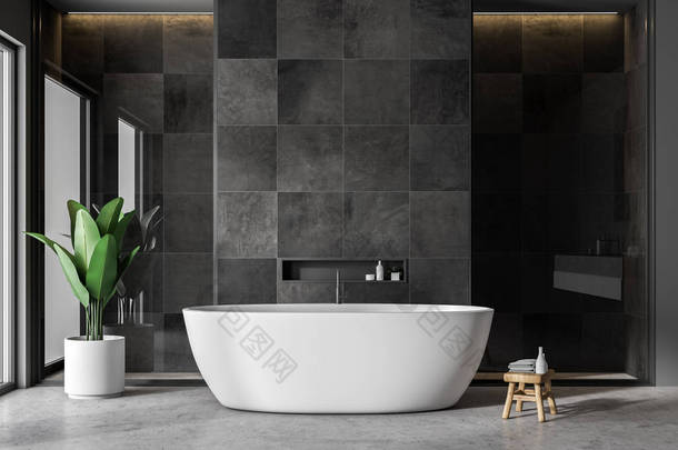 现代化的浴室内部配有黑色<strong>瓷砖</strong>墙壁、混凝土地板和白色浴缸。3d 渲染复制空间