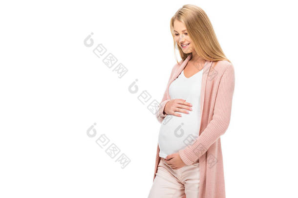 微笑的孕妇触摸腹部, <strong>向下</strong>看孤立的白色