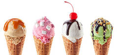 一套四个不同的冰淇淋勺子在华夫饼锥隔离在白色的背景。香草、焦糖、棉花糖和开心果口味.