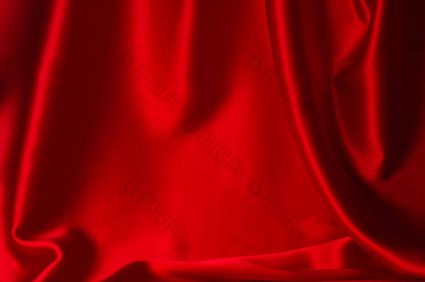 红色<strong>丝绸</strong>或缎子的奢侈面料<strong>质感</strong>可以用作抽象的背景。顶部视图