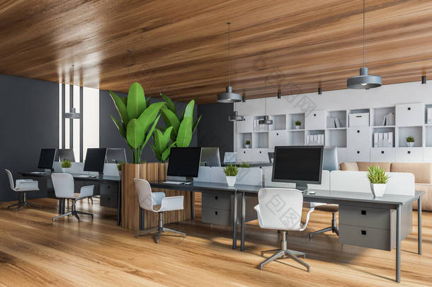 带有白色和黑色墙壁、木制地板、电脑桌和白色书柜的时尚的<strong>开放空间</strong>办公室角落。3d渲染