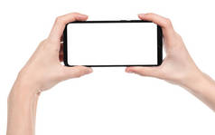 女人的手拿着黑色的新智能手机与空白屏幕隔离的白色背景。使用电话快捷方式的手