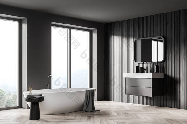 浴室内部用白色浴缸和<strong>水槽</strong>与镜子，花束地板。简约的灰色房间，配有现代家具和全景窗户，可俯瞰乡村，3D效果为零