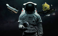 Astronaut and two telescopes James Webb and Hubble. JWST launch art. Elements of image provided by N