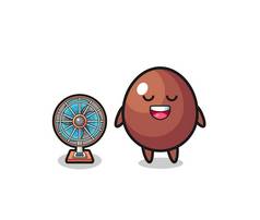 cute chocolate egg is standing in front of the fan , cute design