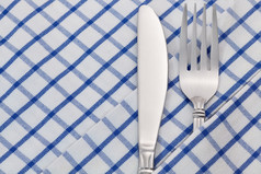 叉而且刀餐巾为餐厅表格背景