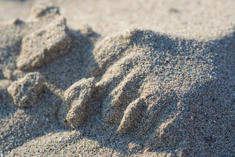 阳光照射的桑迪海滩谷物宏特写镜头背景纹理阳光照射的桑迪海滩谷物宏