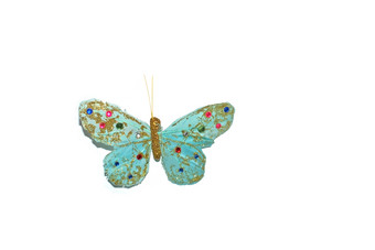 手工制作的绿松石蝴蝶与粉红色的和蓝色的珠子孤立的白色手工制作的绿松石蝴蝶与粉红色的和蓝色的珠子