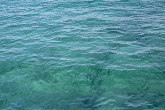翡翠绿色清晰的水背景纹理科斯塔Smeralda撒丁岛意大利翡翠绿色清晰的水背景纹理