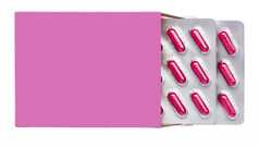 粉红色的盒子与粉红色的药片泡包孤立的背景粉红色的盒子与粉红色的药片泡包