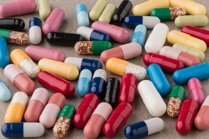 堆色彩斑斓的药物和药片堆色彩斑斓的药物和药片变形背景