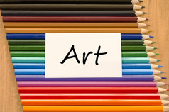 艺术文本概念和彩色的铅笔木背景