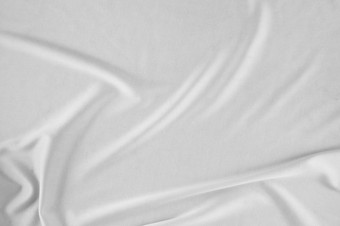 光滑的优雅的白色丝<strong>绸缎</strong>奢侈品布可以使用婚礼背景豪华的圣诞节背景新一年背景设计白色织物纹理布纺织表面前视图光滑的白色丝<strong>绸缎</strong>纹理