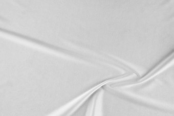 光滑的优雅的白色丝绸缎奢侈品布可以使用婚礼背景豪华的圣诞节背景新一年背景设计白色织物<strong>纹理</strong>布纺织表面前视图光滑的白色丝绸缎<strong>纹理</strong>