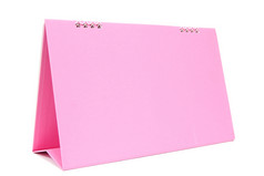 粉红色的空白桌面日历与孤立的白色背景