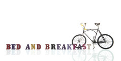 文本床上和早餐与自行车孤立的在白色背景