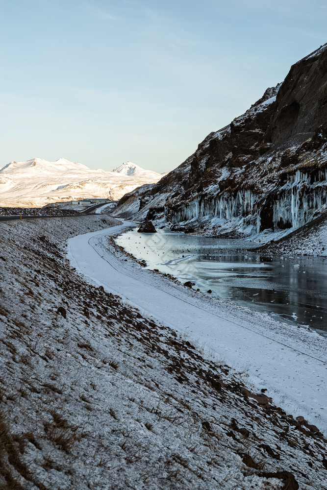 斯奈山半岛半岛冬天日落与冰水的山冰岛斯奈图片