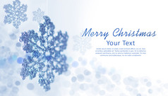 圣诞节蓝色的背景与雪花和的地方为文本