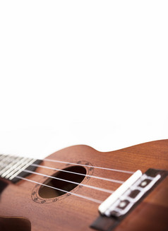 的棕色（的）尤克里里琴吉他孤立的的白色背景模糊概念