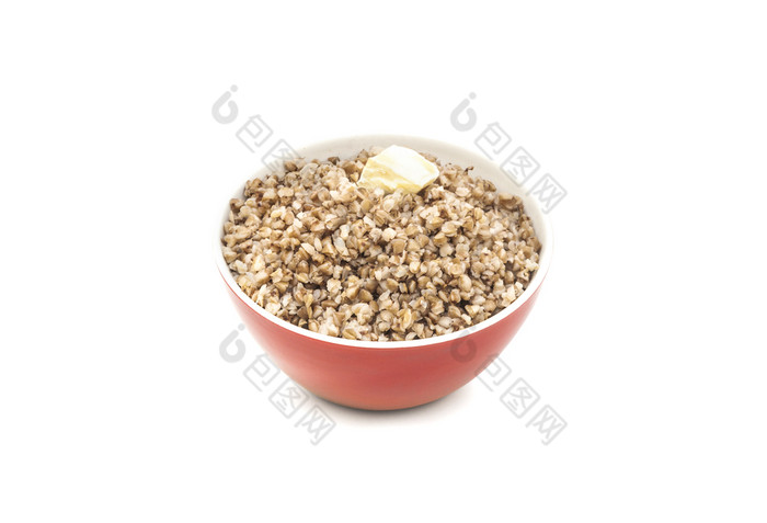 干荞麦红色的陶瓷碗与一块黄油孤立的白色背景干荞麦红色的陶瓷碗孤立的白色泄漏荞麦