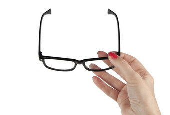 女手持有式的黑框眼镜孤立的白色背景