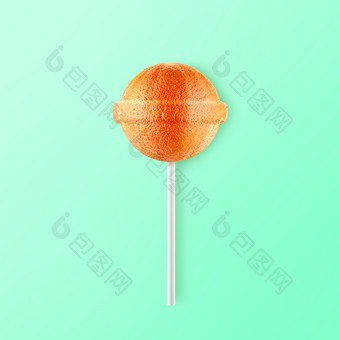 棒棒糖葡萄柚孤立的薄荷背景有创意的糖果的想法棒棒糖葡萄柚