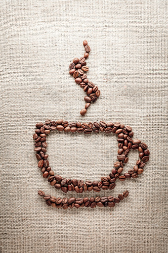 咖啡杯形状粗麻布纹理背景咖啡杯形状粗麻布背景
