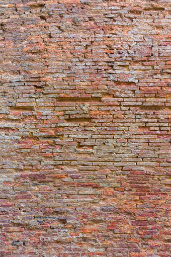 饱经风霜的纹理染色老黑暗棕色（的）和红色的砖墙纹理难看的东西背景红色的砖墙背景垃圾生锈的块配合石块中国砖