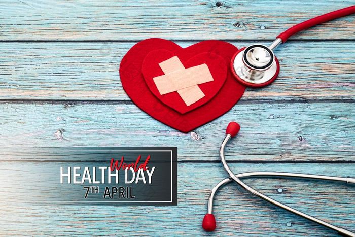 世界健康一天医疗保健和医疗概念红色的听诊器和红色的心的蓝色的木背景