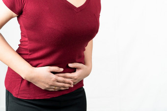 胃痛年轻的女人痛苦从腹部疼痛感觉症状下午白色背景