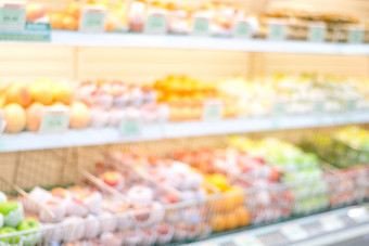 模糊背景模糊超市新鲜的水果货架上杂货店商店与人业务背景概念