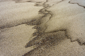 海沙子纹理海沙子与黑色的点湿沙子背景湿沙子背景海沙子纹理海沙子与黑色的点