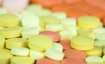 多色的药片黄色的橙色粉红色的颜色说谎的地方特写镜头药物和药物为各种各样的疾病黄色的橙色药丸药物