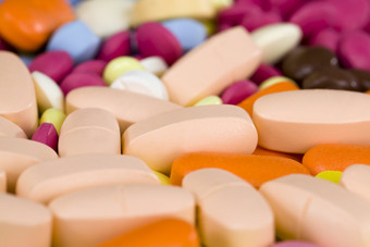 多色的药片黄色的橙色粉红色的颜色说谎的地方特写镜头药物和药物为各种各样的疾病混合药片