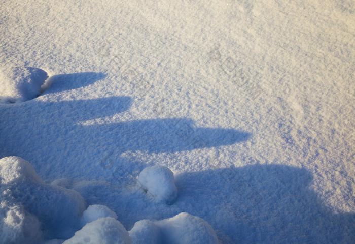 雪地里雪神圣的阳光从后面阴影从现有的海拔高度雪自然表面结构冬天雪地里雪