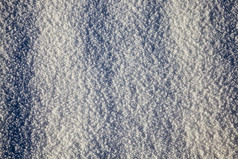 的不均匀结构的美丽的白色雪的冬天季节的白天阳光明媚的天气不均匀结构雪
