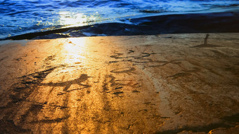 片段史前岩画的岩石海岸湖奥涅加的射线的设置太阳角besov鼻子卡累利阿共和国俄罗斯模糊装饰图案
