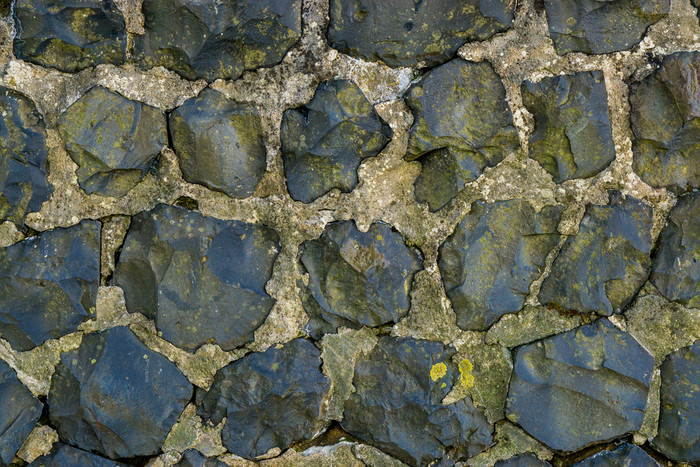 采石场石灰石岩石墙使出大岩石纹理模式背景
