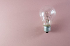 发光的光灯泡粉红色的背景有用的演示概念能源创造力的想法一代