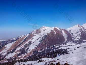 <strong>面积</strong>视图冬天山和蓝色的天空景观冬天自然飞行在滑雪基地特斯基alatoo山tian-shan警察局吉尔吉斯斯坦<strong>面积</strong>视图冬天山和蓝色的天空景观冬天自然飞行在滑雪基地