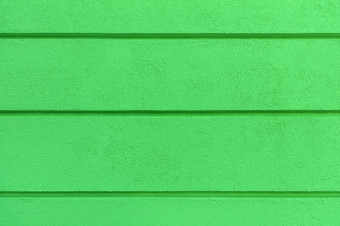 混凝土墙<strong>纹理</strong>与彩色的明亮的绿莱斯特建设coat-plaster使绝缘材料的墙与水平分凹槽混凝土墙<strong>纹理</strong>明亮的绿色<strong>石膏</strong>与水平分凹槽的墙