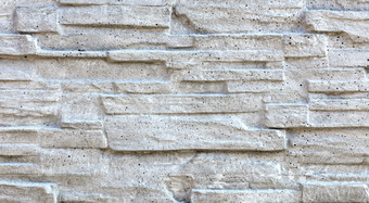 的老石头马赛克使砂岩画与灰色的石灰的老石头马赛克使砂岩覆盖与石灰
