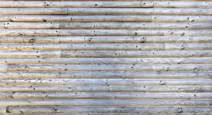 的灰色的日志的木墙是折叠水平纹理老树特写镜头灰色的木墙纹理从固体日志