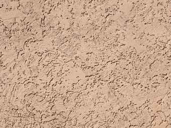 米色变黑墙纹理难看的东西背景宽松的纹理沙子米色石膏的墙石膏宽松的纹理沙子