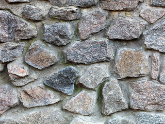 无缝的纹理石头墙花岗岩石头铺平道路石头墙背景摘要背景老石头鹅卵石特写镜头石头墙从大花岗岩鹅卵石特写镜头