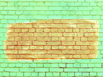 老砖墙是画与明亮的绿色油漆和的选择片段橙色的老明亮的绿色石灰砖墙的选择片段画与橙色油漆