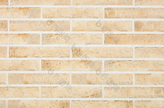 的背景和纹理的墙是排与光米色长方形的砖与划痕和污渍复古的风格的墙面对与光米色长方形的砖与粗糙度水平执行墙纹理与光滑的水泥关节