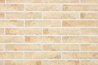 的背景和纹理的墙是排与光米色长方形的砖与划痕和<strong>污渍</strong>复古的风格的墙面对与光米色长方形的砖与粗糙度水平执行墙纹理与光滑的<strong>水泥</strong>关节